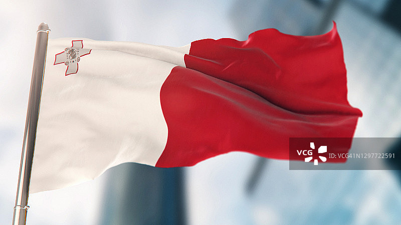 马耳他国旗与失焦的城市建筑图片素材