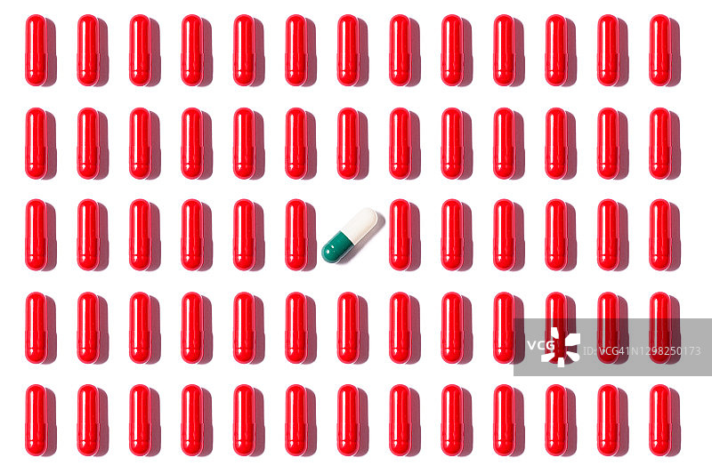 白色背景上的红色胶囊重复图片素材