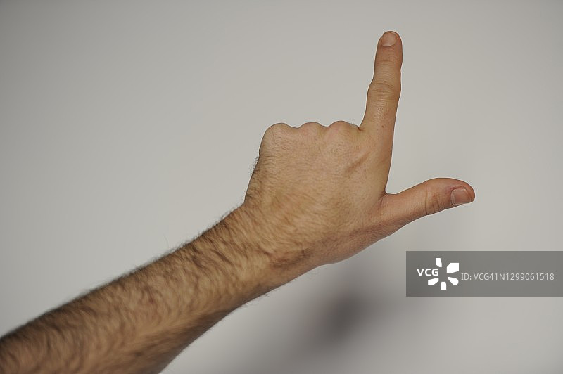 手持食指向上指图片素材