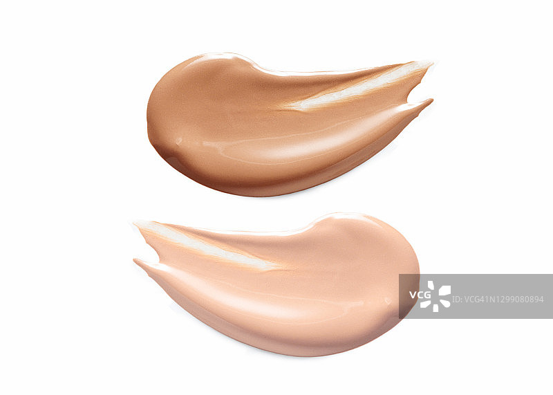 白色背景上的深色和浅色粉底液样品图片素材