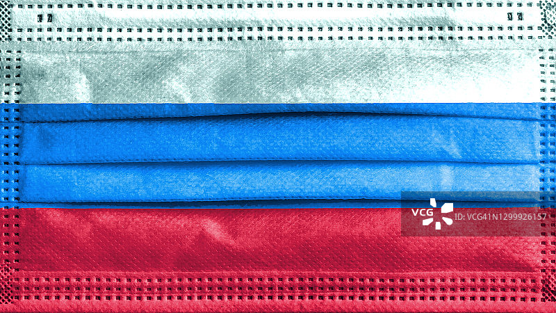 印有俄罗斯国旗的手术口罩，新型冠状病毒疫情概念图片素材