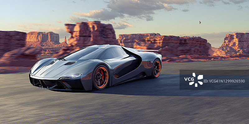 一辆行驶在岩石景观中的通用电动跑车图片素材