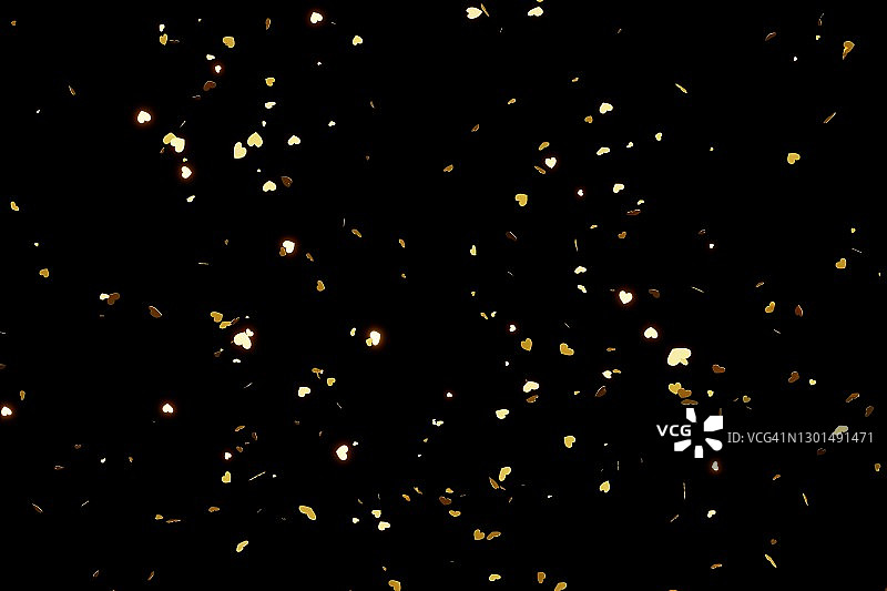 金色爱心纸屑在黑色背景上飞溅，情人节概念图片素材
