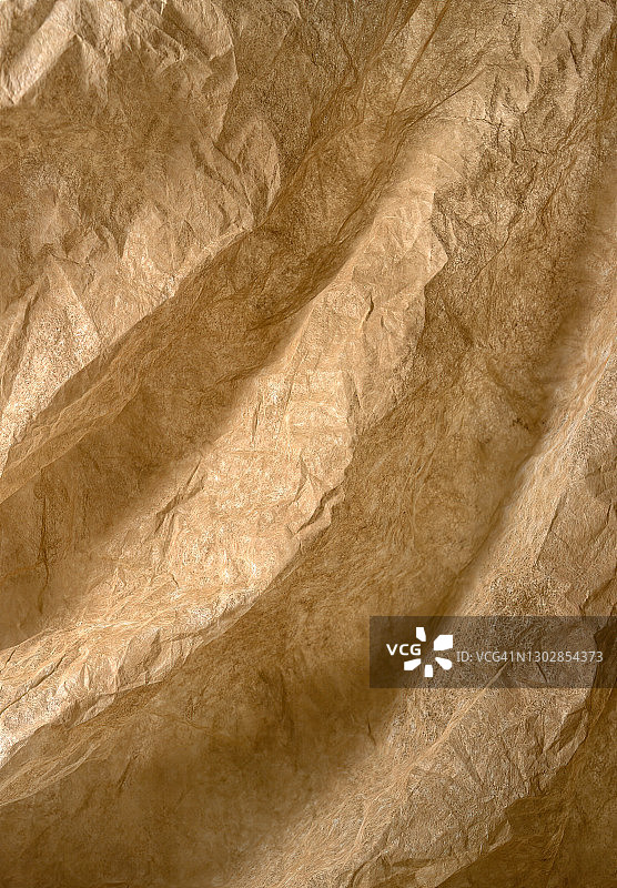 带有褶皱和脊的棕色纸张纹理图片素材