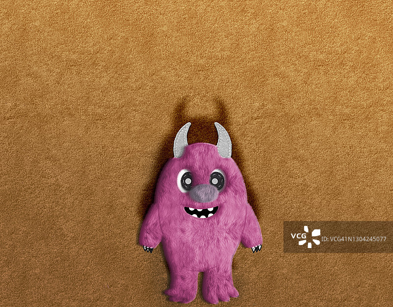 棕色背景中的粉色甜美怪物图片素材