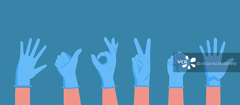 戴蓝色橡胶医用手套的手图片素材