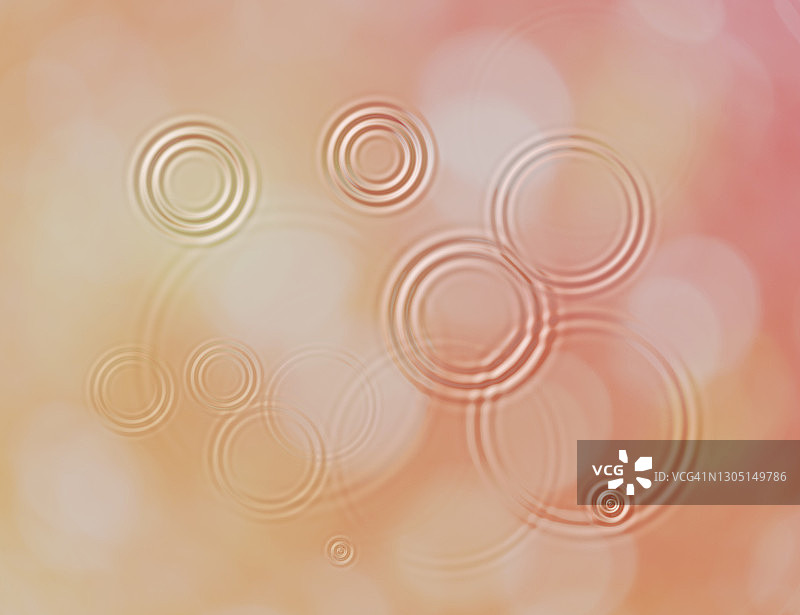 雨滴落在水面产生的同心圆全画幅图片素材