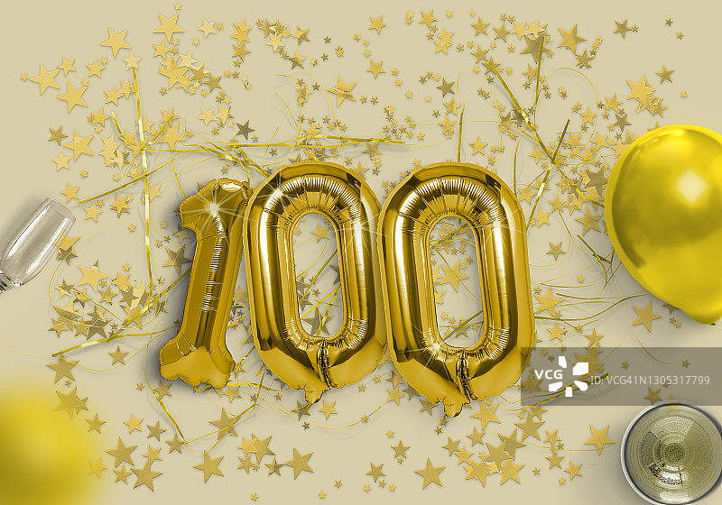 金色背景中的100个金色箔气球图片素材