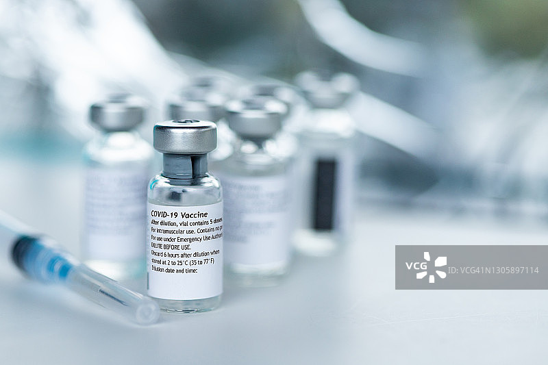 新型冠状病毒疫苗瓶微距特写图片素材