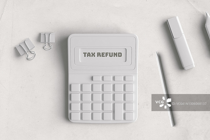 白色计算器、铅笔和白色夹子，退税概念图片素材