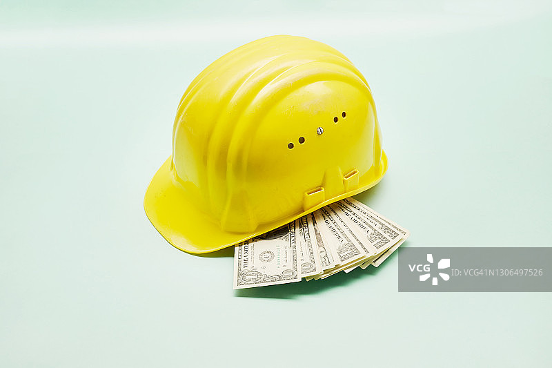 黄色安全帽和美元静物摄影图片素材