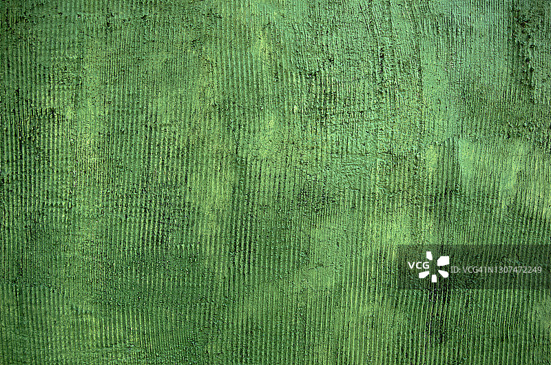 橄榄绿色的粗糙纹理旧灰泥墙图片素材