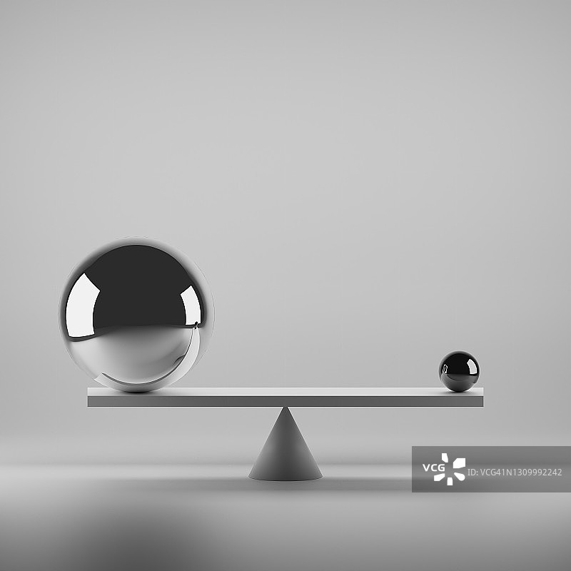 大小光面球在平衡板上保持平衡的黑白照片图片素材
