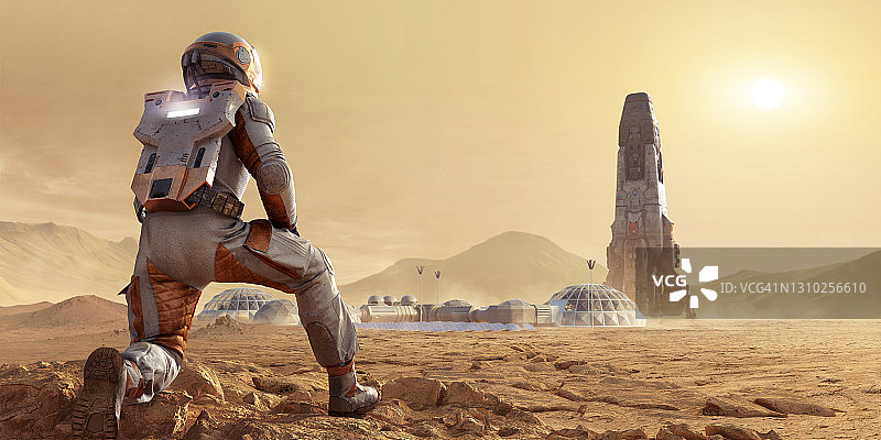 宇航员在火星上跪地，眺望基地营地和火箭图片素材
