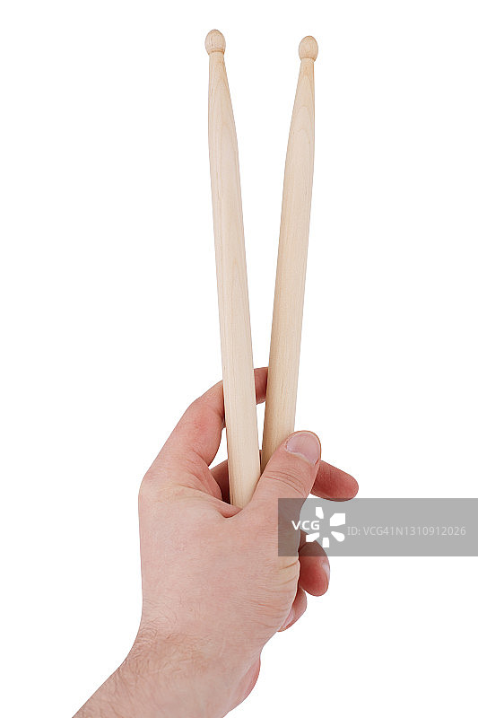 白色背景上男人手中的鼓槌图片素材