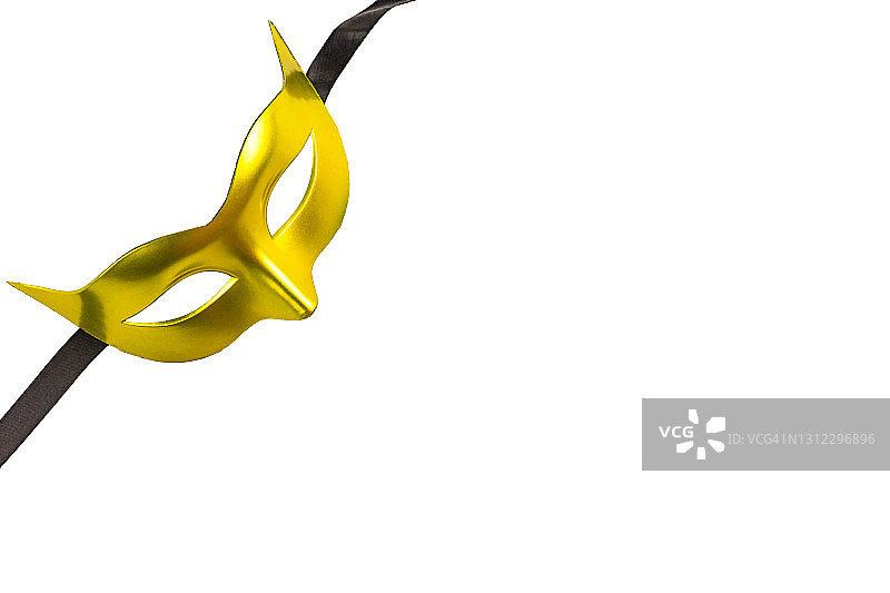 白色背景上带黑色丝带的金色狂欢节面具特写图片素材
