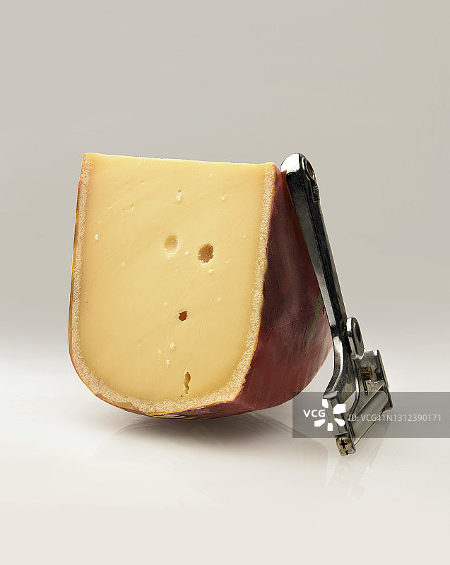 高达奶酪楔形块与切片器图片素材