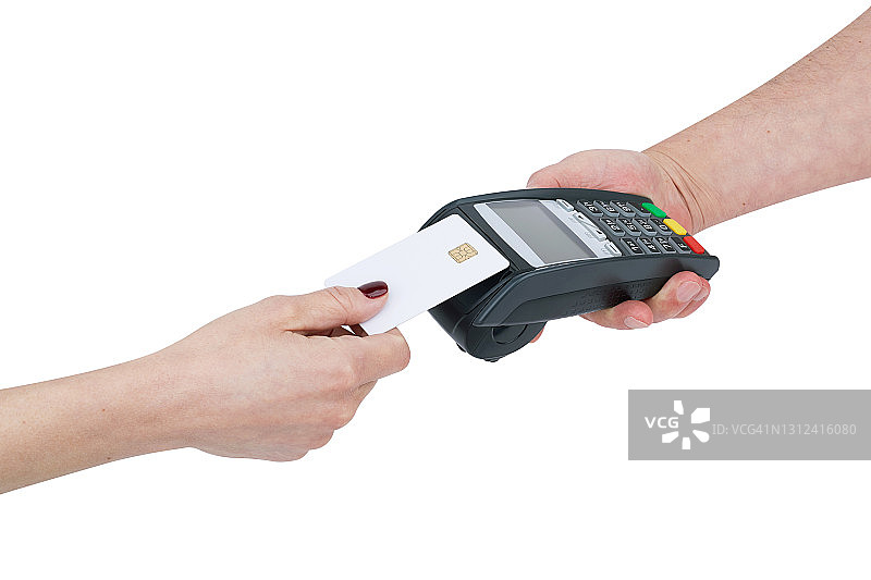 女人用信用卡支付，通过信用卡读卡器进行非接触式支付图片素材