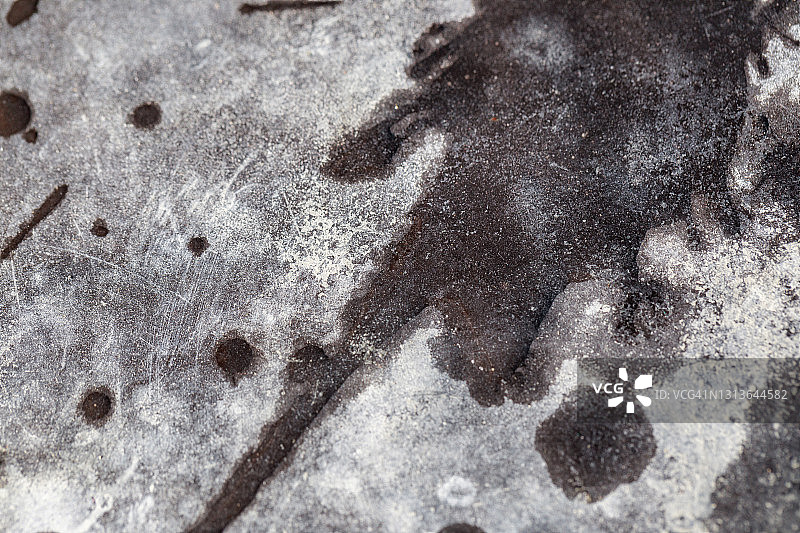 英国混凝土上的污渍微距照片图片素材