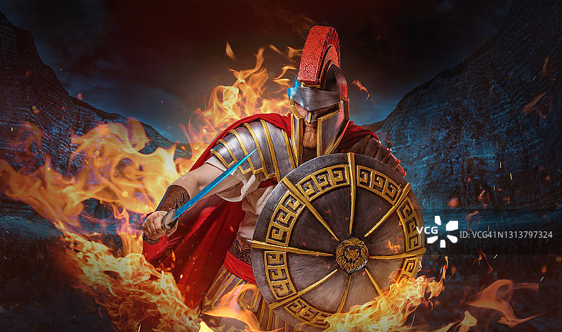 在充满火焰的战斗竞技场中的红发战士角斗士图片素材