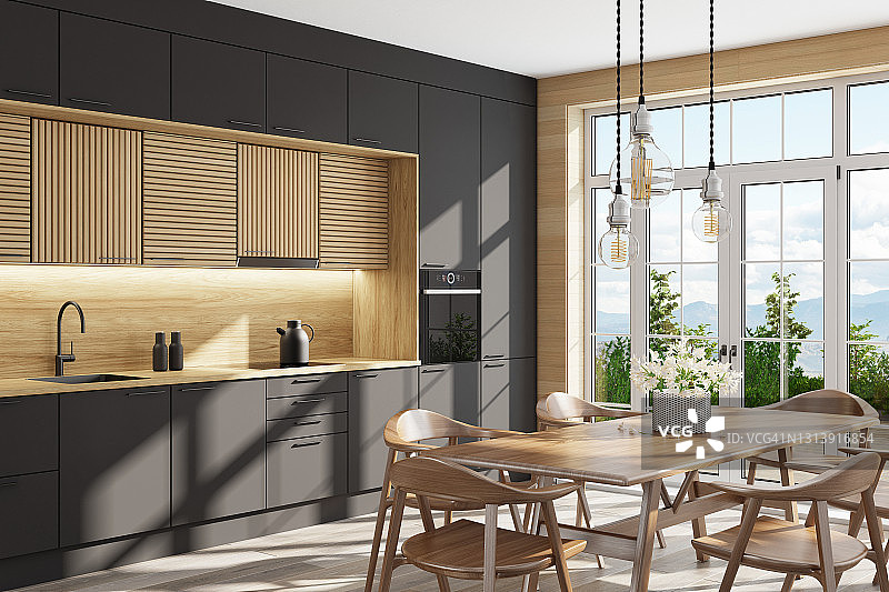 斯堪的纳维亚风格的黑Light and light wood厨房，配有大型餐桌椅。大窗户。开放式厨房概念。夏季场景。图片素材