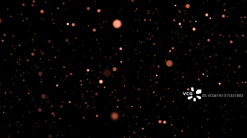 深色背景上散焦的金色颗粒闪光，带有复制空间。圣诞节叠加图片素材