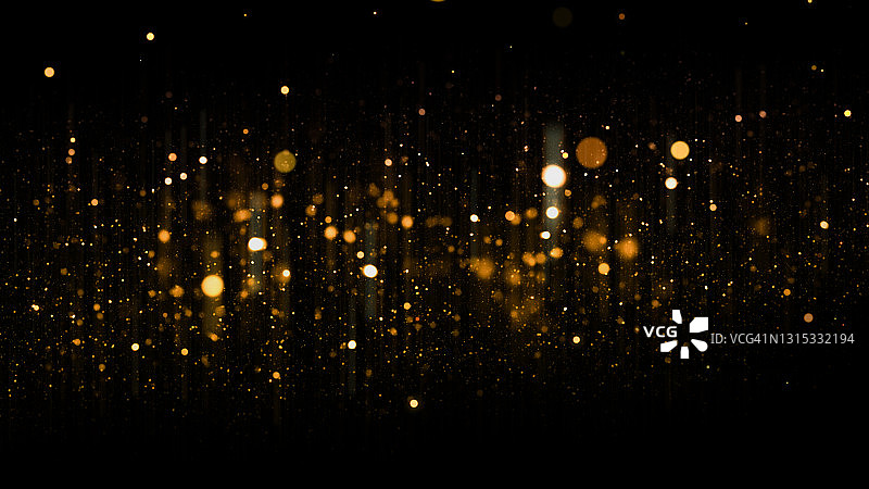 深色背景上散焦的金色颗粒闪光，带有复制空间。圣诞节叠加图片素材