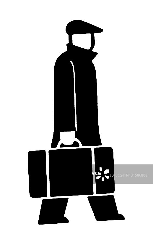 穿大衣提箱子的男人图片素材