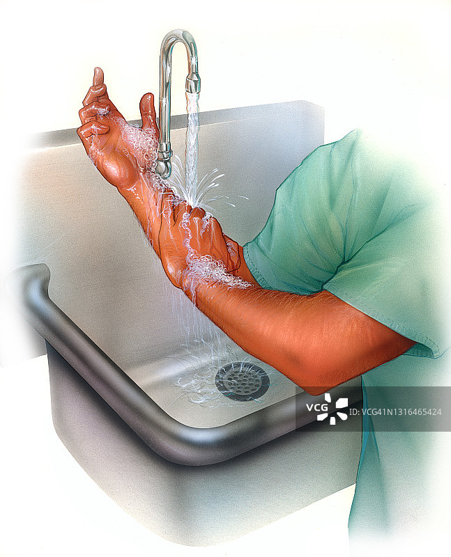 医生在水槽中洗手，认真擦洗，保持无菌。图片素材