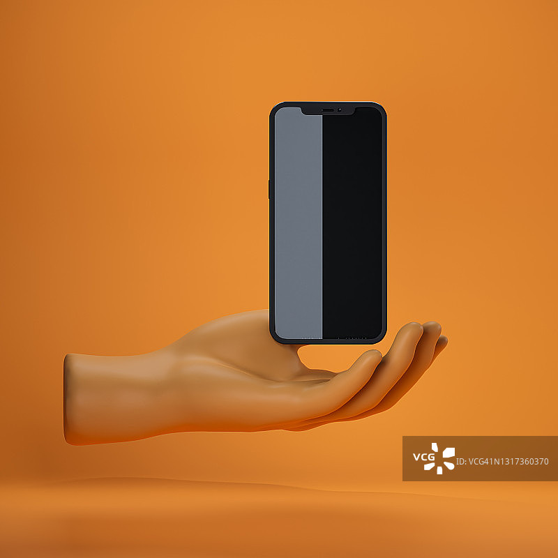 手握灰色和黑色部分垂直分屏的智能手机图片素材