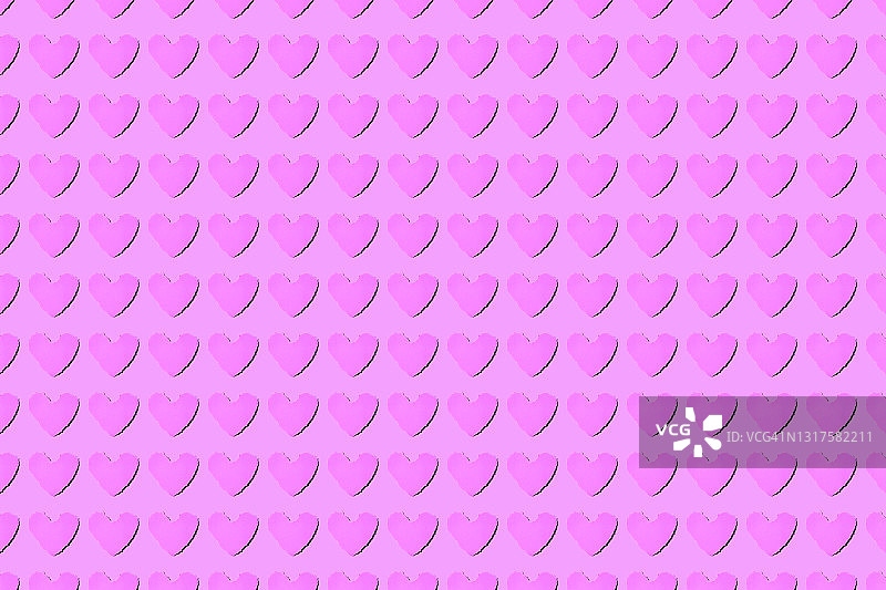 粉色背景上的心形再生纸棒图片素材