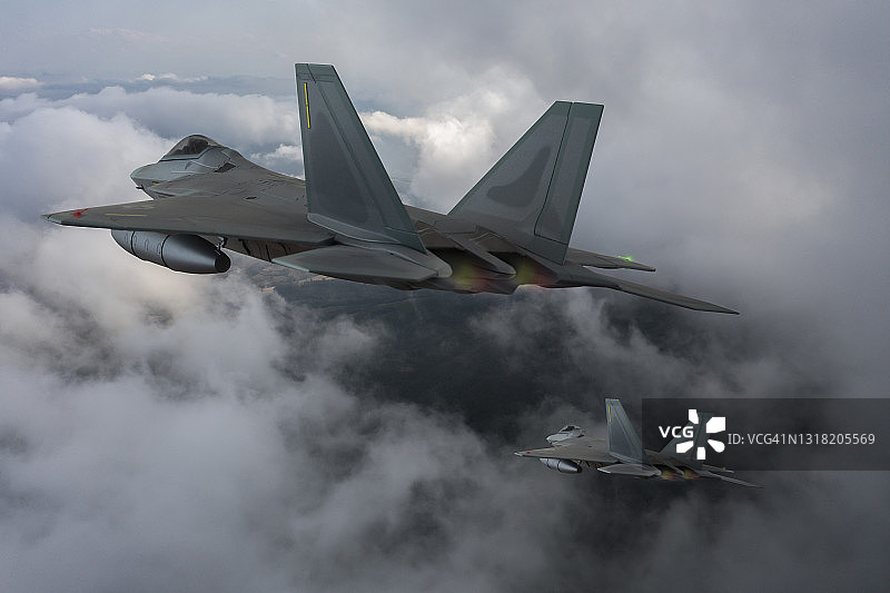 喷气式战斗机飞过云层。图片素材