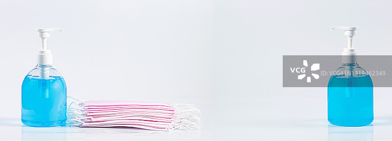 白色背景上的酒精凝胶洗手液和口罩，外科口罩图片素材