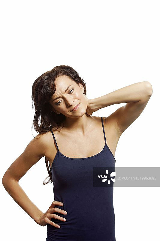年轻女人手扶酸痛的脖子图片素材