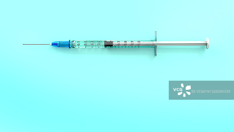 蓝绿色背景上的注射器图片素材