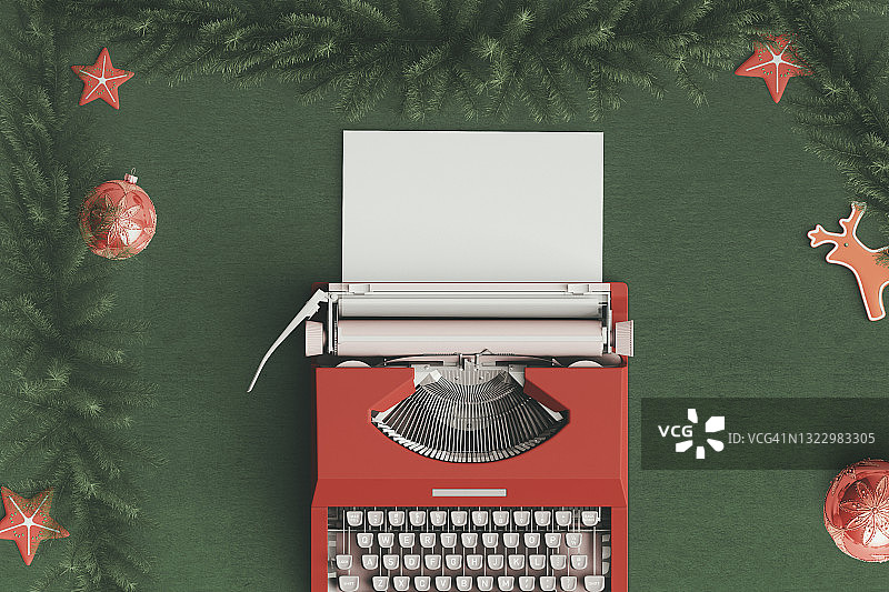 70年代打字机的俯视图，带有空白纸张和圣诞装饰图片素材