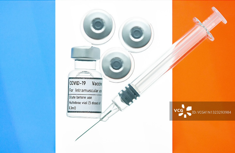 带有法国国旗的新冠病毒疫苗瓶图片素材