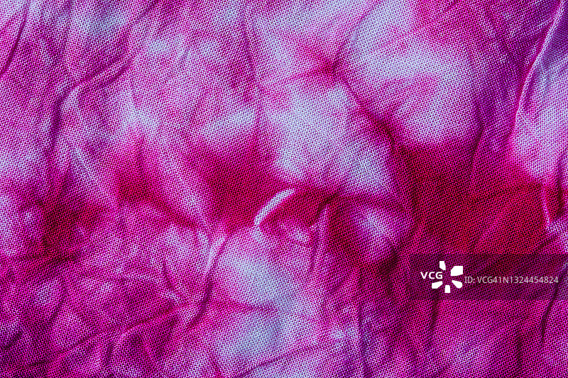 红色蜡染织物纹理和纺织背景特写图片素材