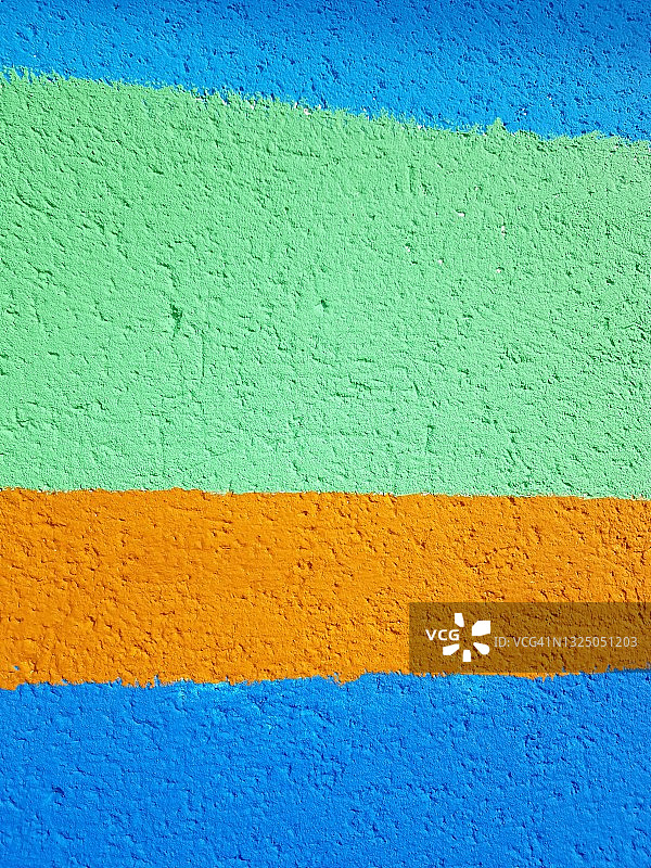 涂有各种颜色的抹灰墙多彩背景，满版图片素材