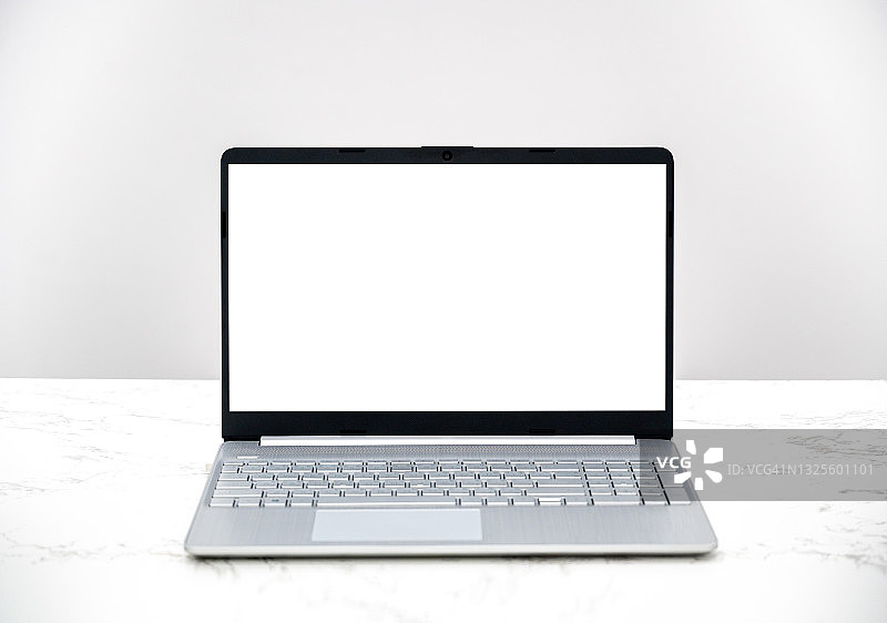 白色办公桌上的计算机白色屏幕笔记本图片素材