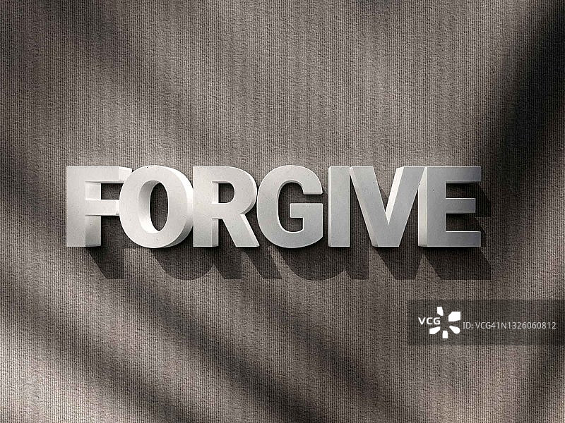 灰色水泥背景上的“原谅”字样图片素材