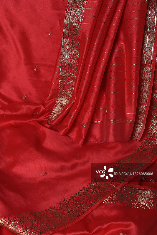 印度粉橙色金边纱丽特写图片素材