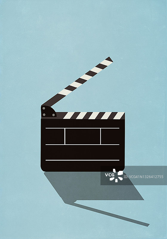 蓝色背景上的电影场记板图片素材