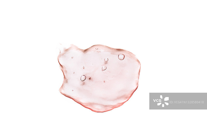 白色背景上带气泡的粉色化妆水涂抹，扁平风格，微距图片素材