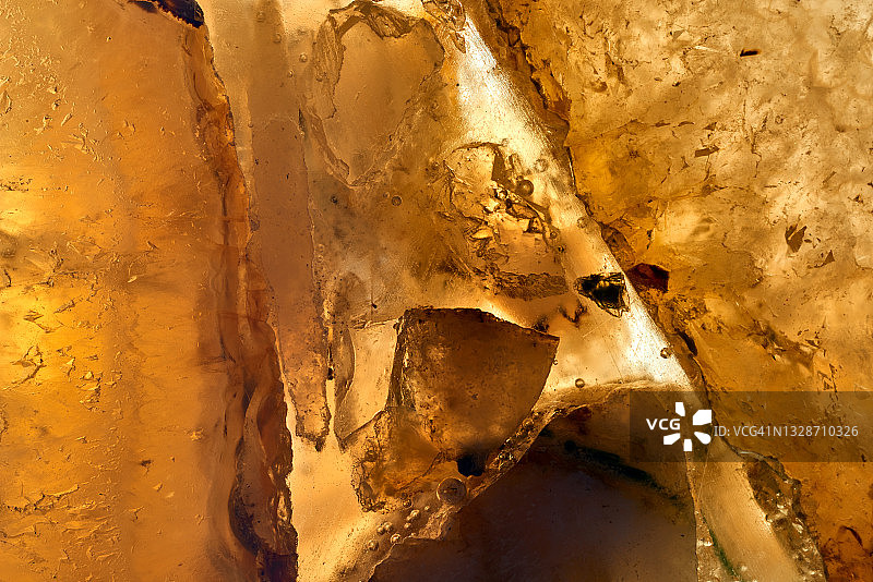 抽象黄色水晶背景大理石纹理，自然图案图片素材