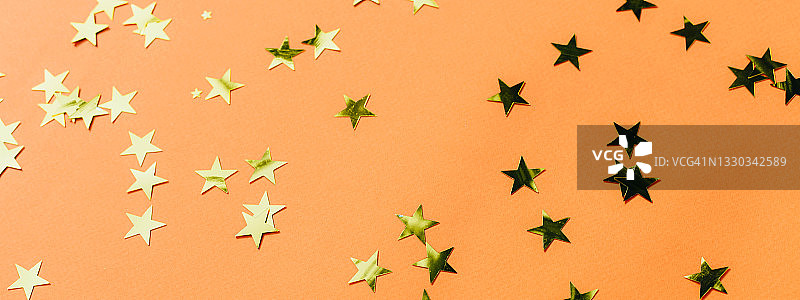 橙色背景与金色星星图片素材