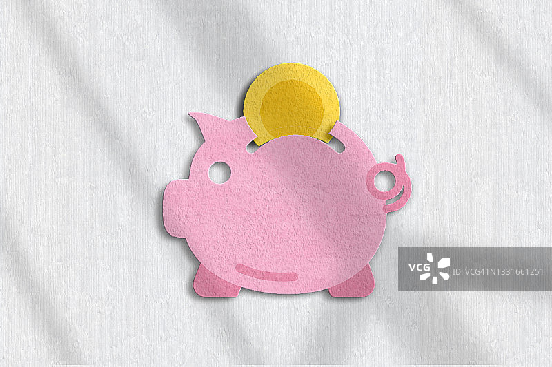粉色背景中的小猪储蓄罐俯视图图片素材