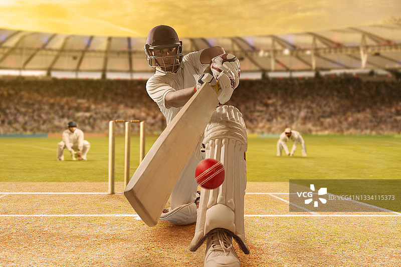 体育场板球比赛中击球手击球图片素材