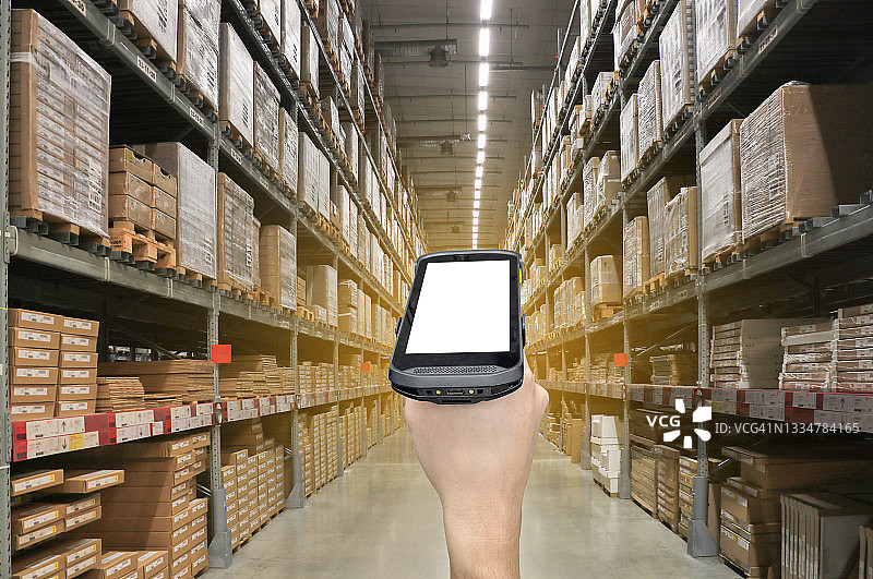 仓库中带有条形码扫描器的数字条形码扫描器图片素材