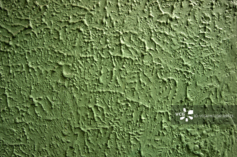 浅橄榄绿色的纹理灰泥墙图片素材